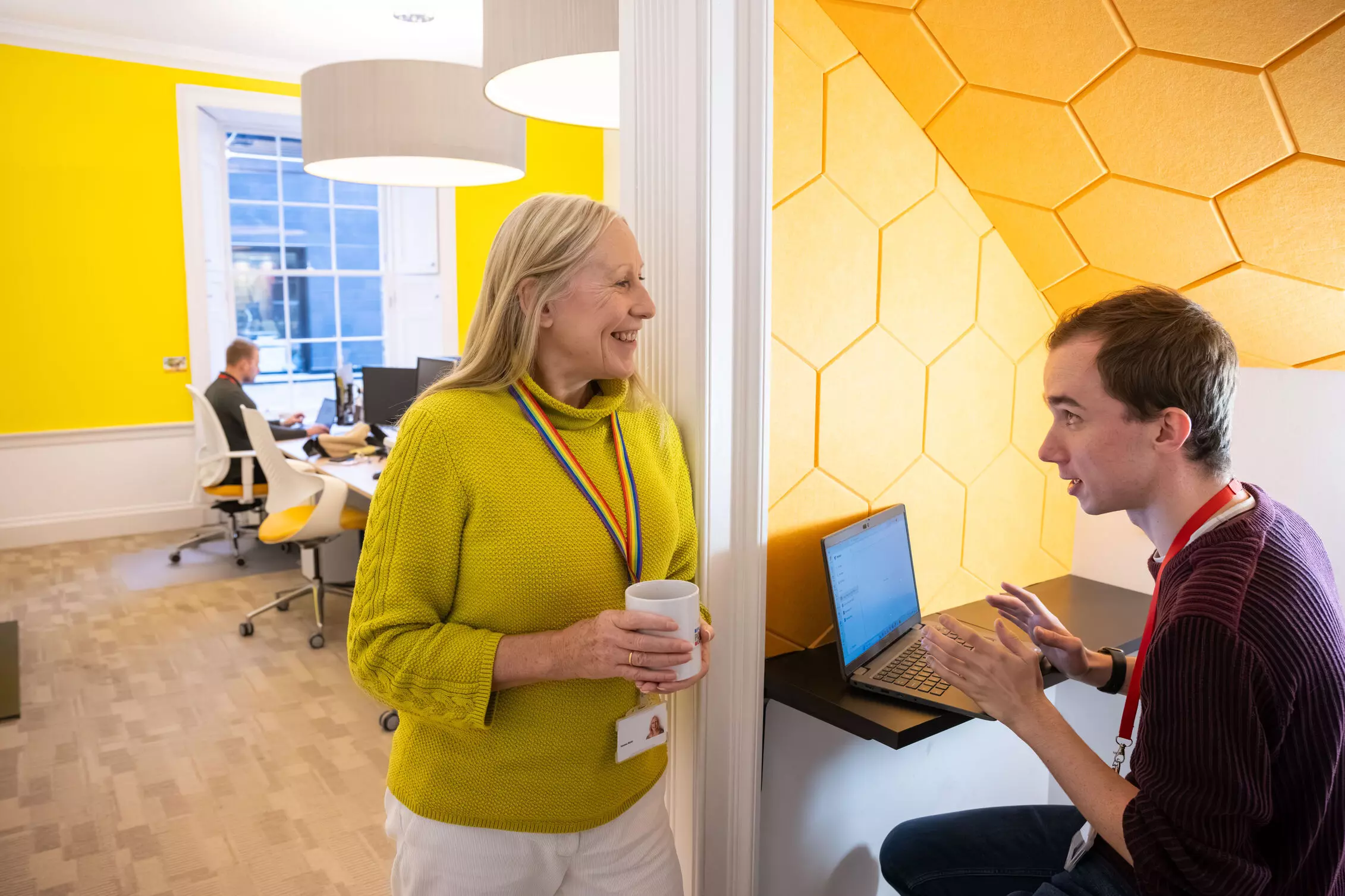 A group of winners celebrating a win, showing a street sign