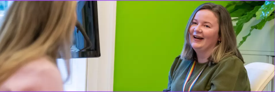 Employees at desk in office